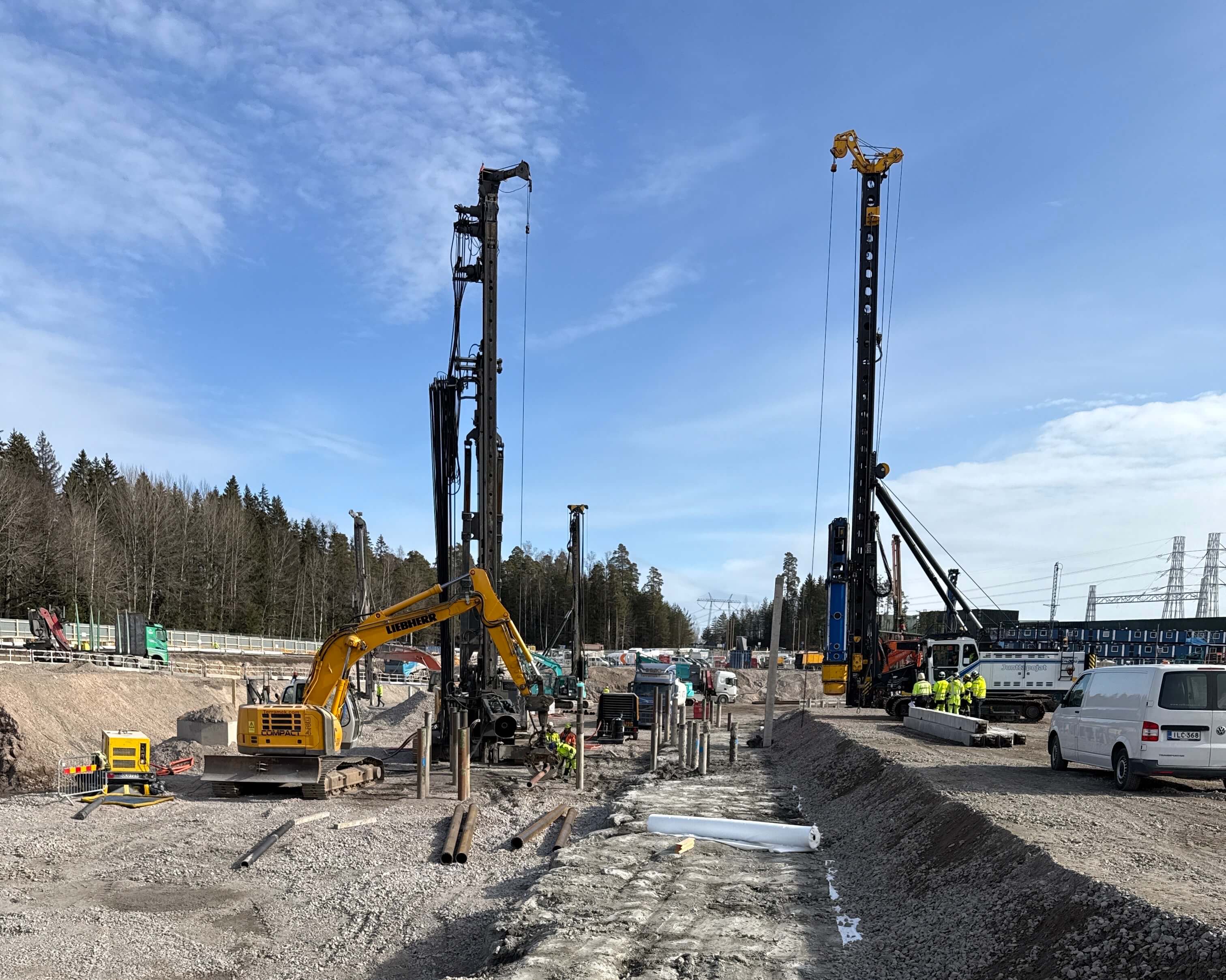 Work site with construction workers and machinery