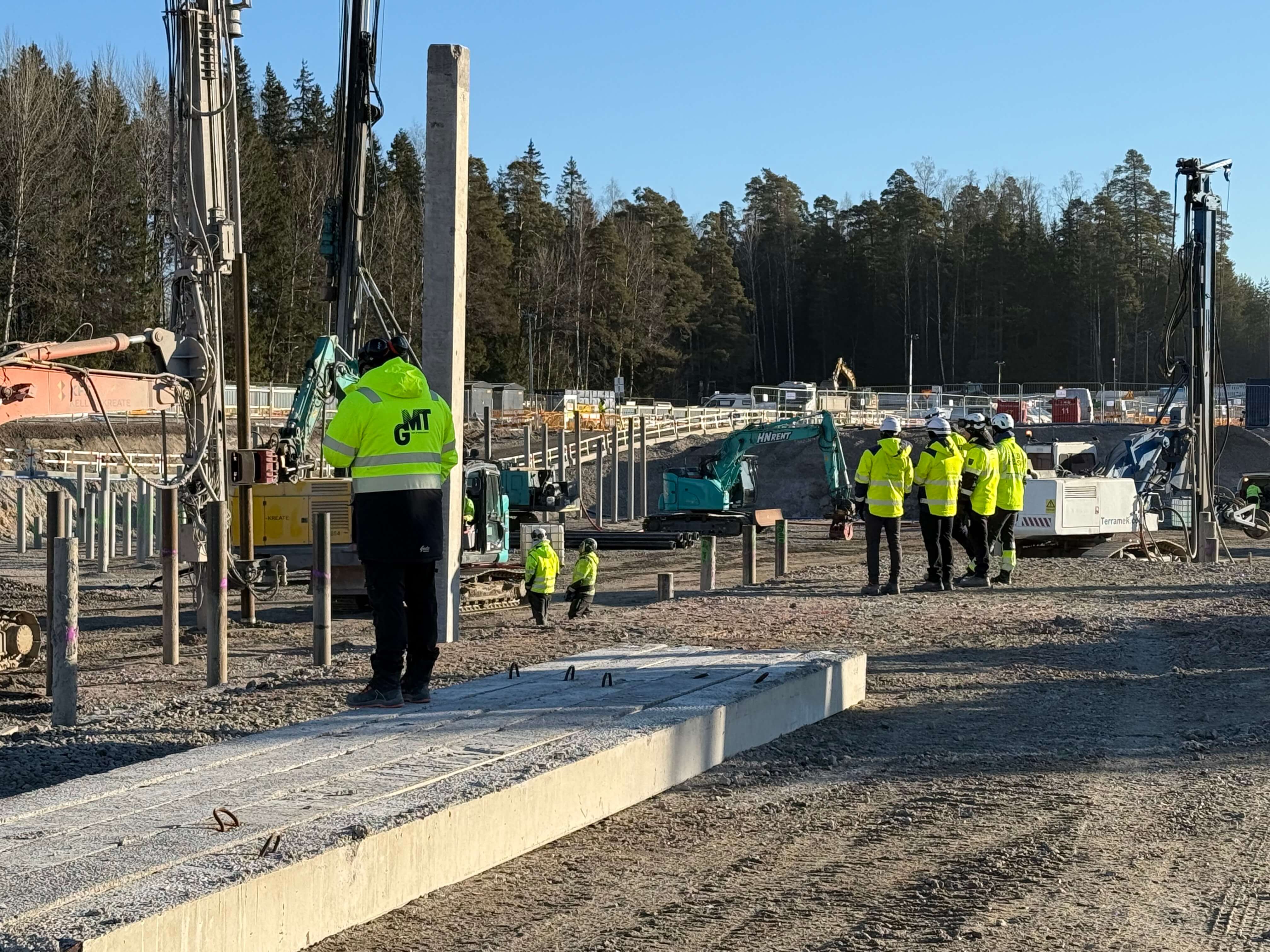 A diverse team of construction professionals collaborating on a project
