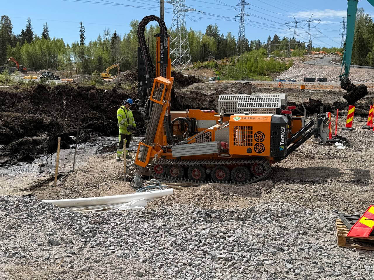 A construction worker performing a site test with advanced equipment